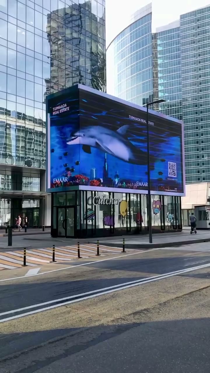 A dolphin in underwater Dubai on a 3D Naked-Eye media facade in Moscow City